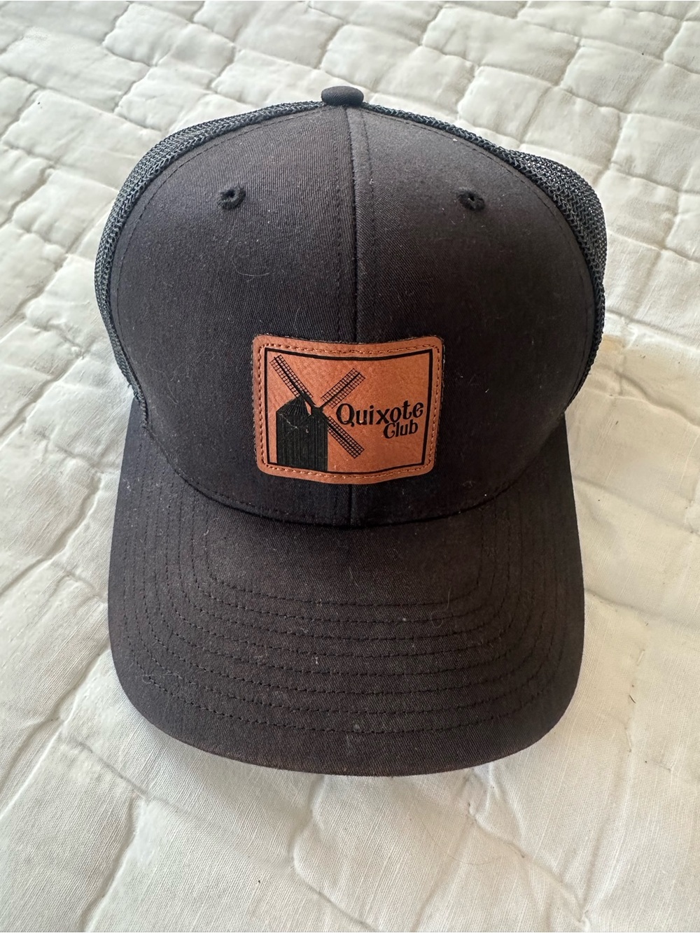 Black Trucker Hat with Leather Patch

Quixote club Sumter sc